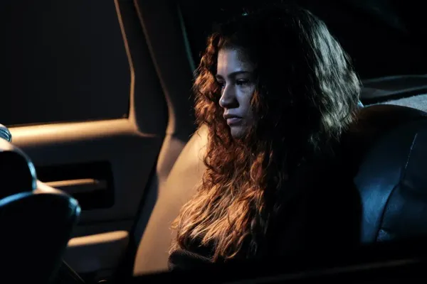 Rue (Zendaya) in the backseat of a darkened car. Euphoria s2e1.